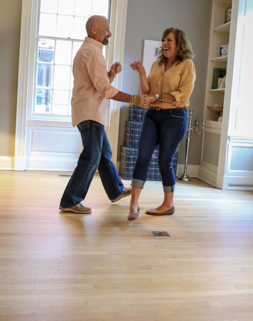Couple Dancing on Wood Floor