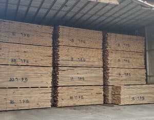 Stacks of lumber are loaded into the kiln to continue the drying process. 