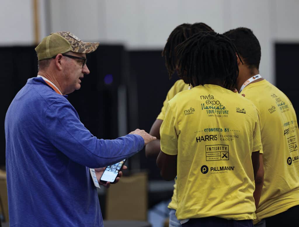Sprigg Lynn talks with a few students