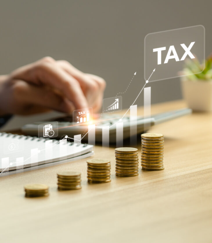 Businessman calculating annual taxes and paying taxes. Tax deduction planning concept. Expenses, account, VAT, income tax, Calculation of taxes, expenses, exemptions, deductions, donations