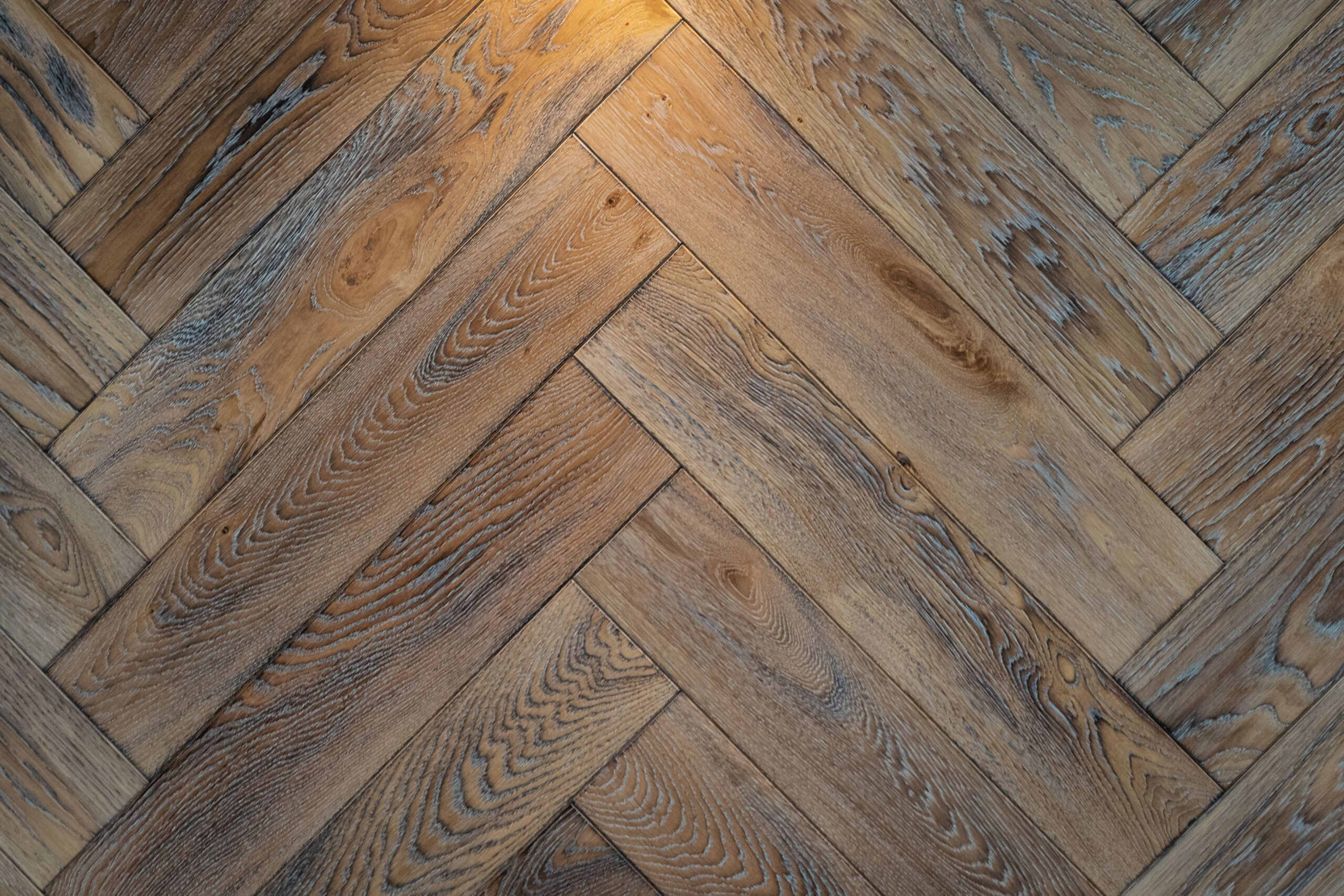 Wooden floor texture - old premium oak parquet in close-up.